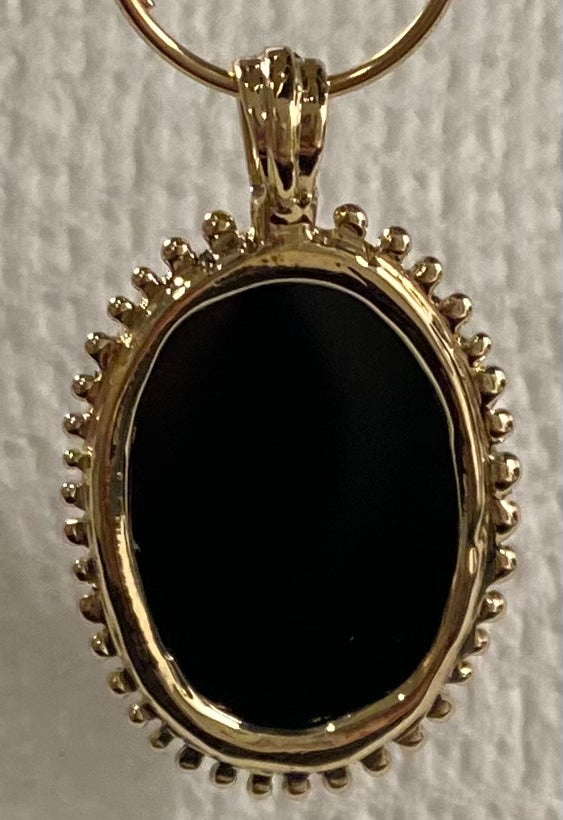 Gold and Black onyx engraved snake charm